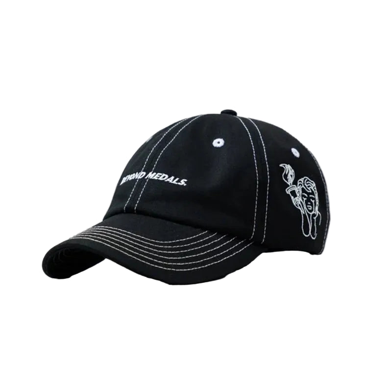 A black baseball cap with white contrast stitching, featuring 'TERRAD MEDALS.' embroidered on the front and a white graphic on the side, set against a solid gray background.