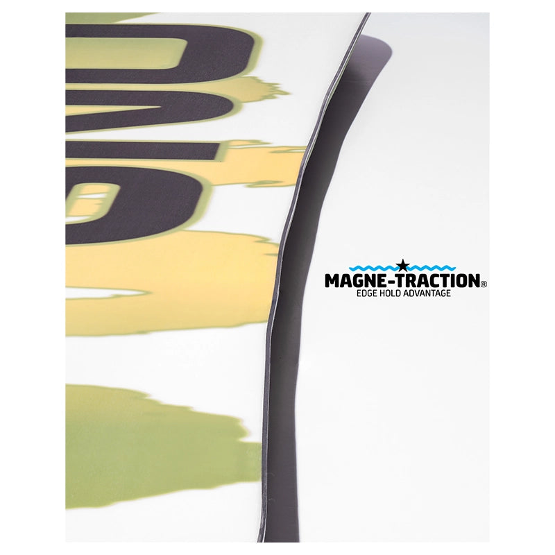 Close-up of a white ski boot shell with a dark gray Magne-Traction edge control and part of a yellow-and-black graphic design. The Magne-Traction logo is visible on the right side.