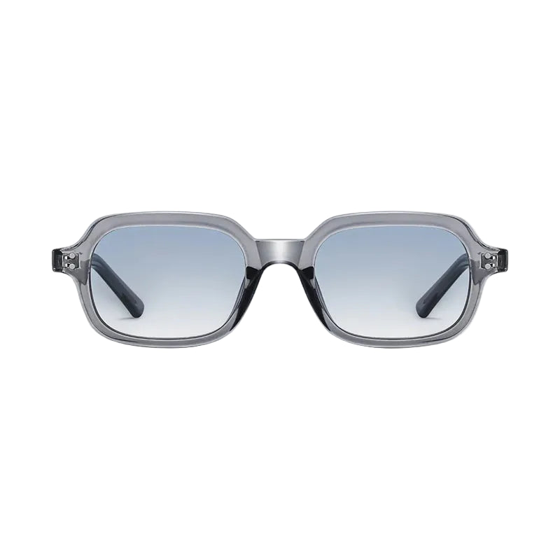Sunglasses with a clear frame and blue gradient lenses on a light gray background