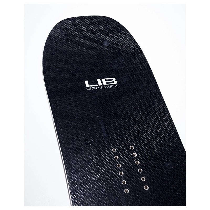Close-up of the underside of a black textured snowboard deck with visible grip tape texture, silver binding hardware, and a white 'LIB' brand logo near the center.