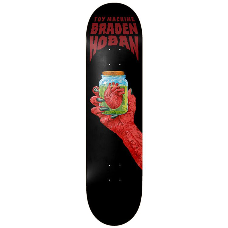 A skateboard deck shown vertically against a plain white background. The deck has a black base with red text reading 'TOY MACHINE BRADEN HOBAN' at the top and a central graphic of a red hand holding a glass jar containing a red anatomical heart.