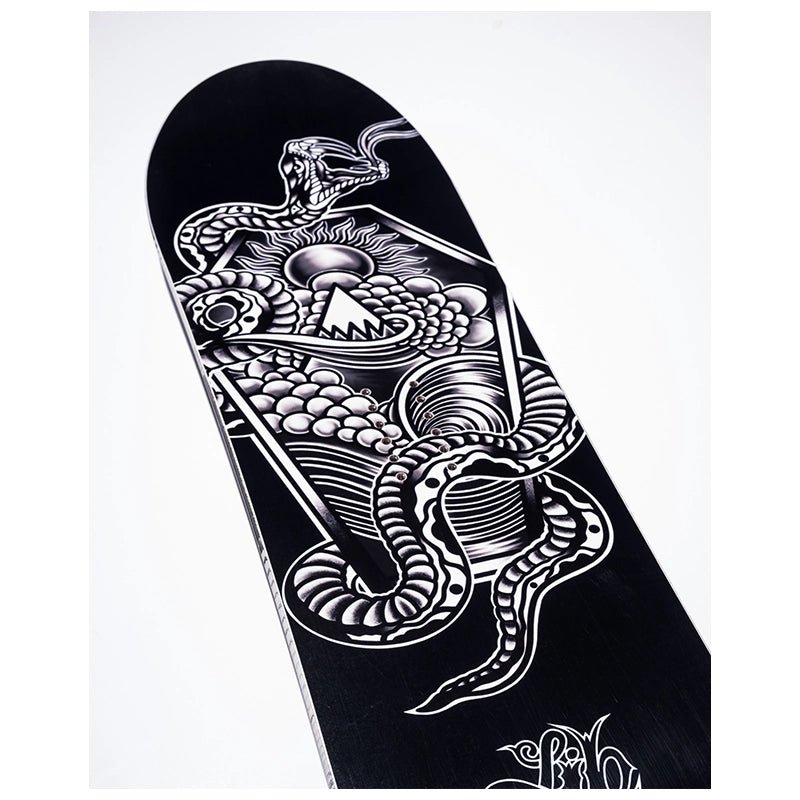 A skateboard deck with a black background and a highly detailed white and gray graphic illustration of a snake, skull, and geometric patterns.