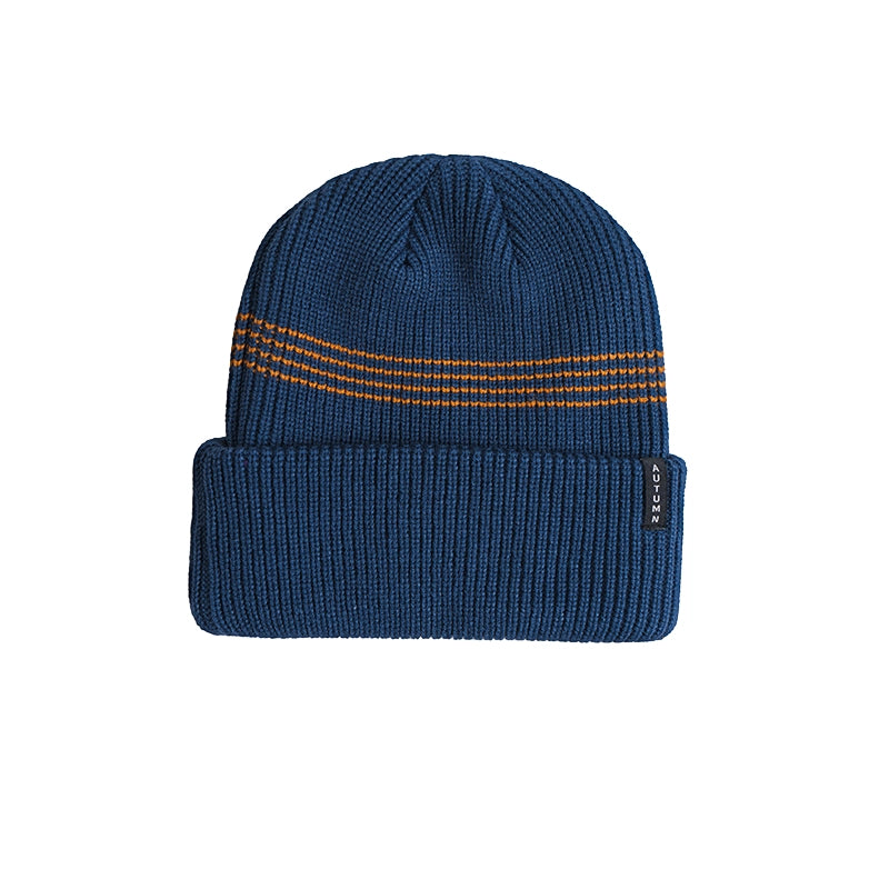 A navy blue ribbed knit beanie hat with three horizontal orange stripes across the upper portion and a small black brand tag on the folded cuff, shown against a plain white background.