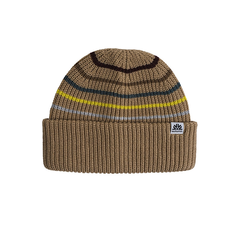 A brown ribbed knit beanie hat with horizontal stripes in black, dark blue, yellow, and light blue, featuring a small white embroidered logo patch on the cuff.