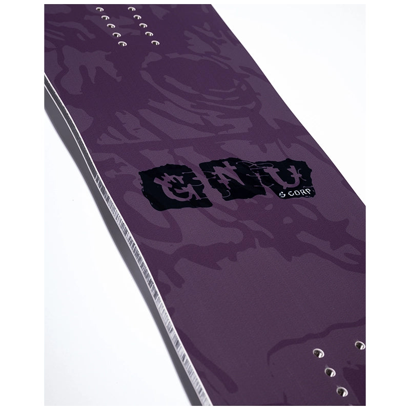 A close-up of a purple snowboard base featuring a dark abstract graphic pattern, a black 'G128' logo, and silver metal binding eyelets along the edge, set against a plain white background.