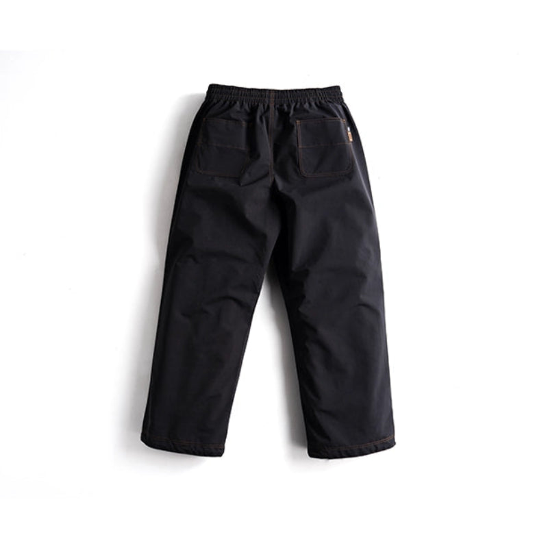 Black snow pants with elastic waist and orange stitching back view