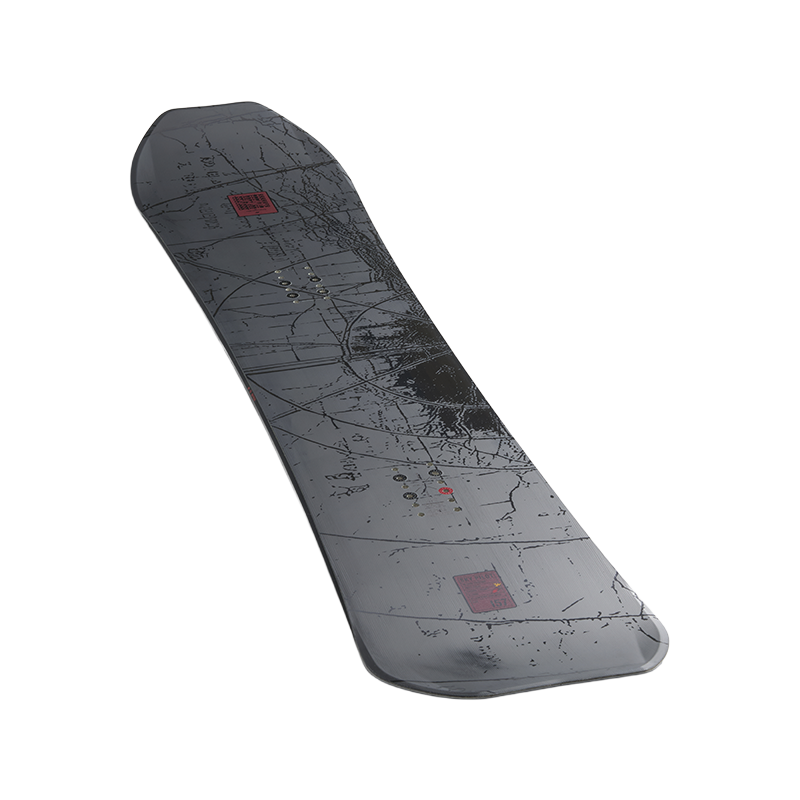 A snowboard shown from the base side, featuring a dark gray and black abstract map-like graphic with small red square accents, isolated on a white background.