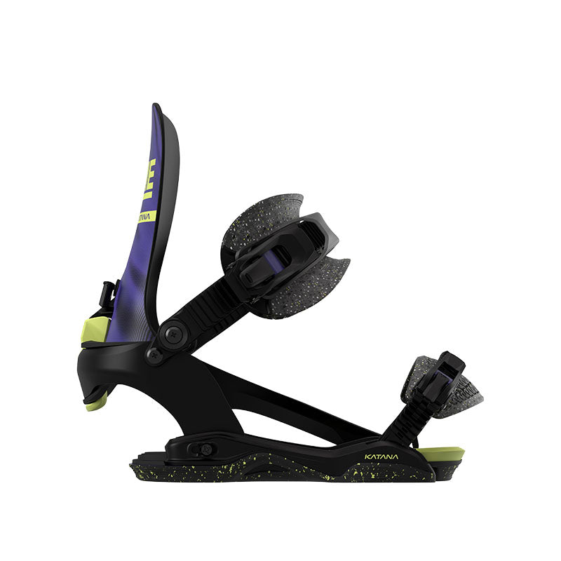 A single snowboard binding shown in profile on a plain white background. The binding is predominantly black with a purple rear rail, lime green accents, and gray textured foam pads.