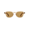 A pair of round-frame sunglasses with translucent warm beige frames and brown-tinted lenses, shown from the front on a light gray background.