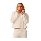 A woman modeling a matching cream-colored textured lounge set, featuring a cropped long-sleeve hoodie with a drawstring hood and coordinating shorts, shot against a solid white background.