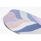 Colorful wavy-patterned mat on a white background