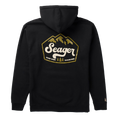 A black pullover hoodie shown from the back, featuring a large graphic print on the back with the brand name 'Seager' in white script inside a gold mountain-shaped border, with the tagline 'HEADIN' WHERE THE RIVER GROWS' and small pine tree illustrations.