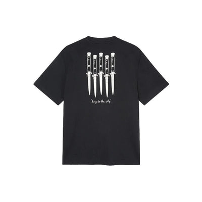 A black short-sleeve t-shirt shown from the back, featuring a graphic of five knives with white handles and the text 'keep to the city' printed in white below them.
