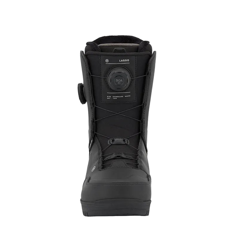 A black Lasso snowboard boot with a dial closure system, shown from the front against a light gray background.