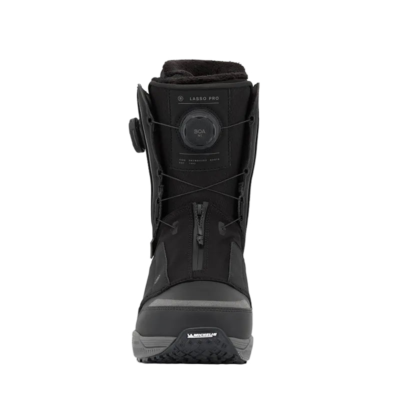 A black Ride Lasso Pro snowboard boot with a dial closure system, shown from the front against a light gray background.