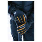 Showing the black gloves with leather palms out in the cold