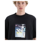 A model wearing a black oversized crewneck t-shirt with a square graphic print on the front depicting cocktail glasses and the text 'BEYOND MIDDLE'.