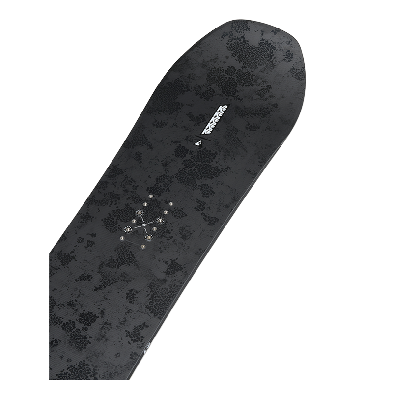 A black snowboard with a subtle dark gray floral pattern and a white 'TERRAFORM' logo near the nose, shown diagonally on a solid white background.