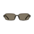 A pair of square-frame sunglasses with translucent smoky gray frames and brown-tinted lenses, shown from the front on a light gray background.