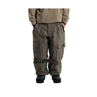 A person shown from the chest down wearing dark gray cargo pants, a ribbed olive-khaki long-sleeve top, and black boots against a plain white studio background.