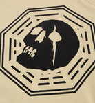 Close-up of a cream-colored fabric surface featuring a bold black graphic print of a skull and sword inside an octagonal border.