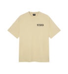 A light beige short-sleeve t-shirt with a small black and white 'CAPiTA' box logo printed on the left chest, displayed on a clean white background.