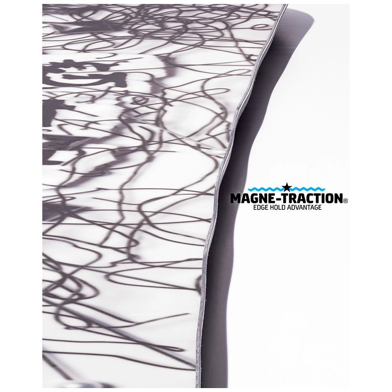 A close-up of a white fabric surface with a black abstract scribble pattern, folded over to show a dark gray underside, with the MAGNE-TRACTION Edge Field Advantage logo printed on the white side.