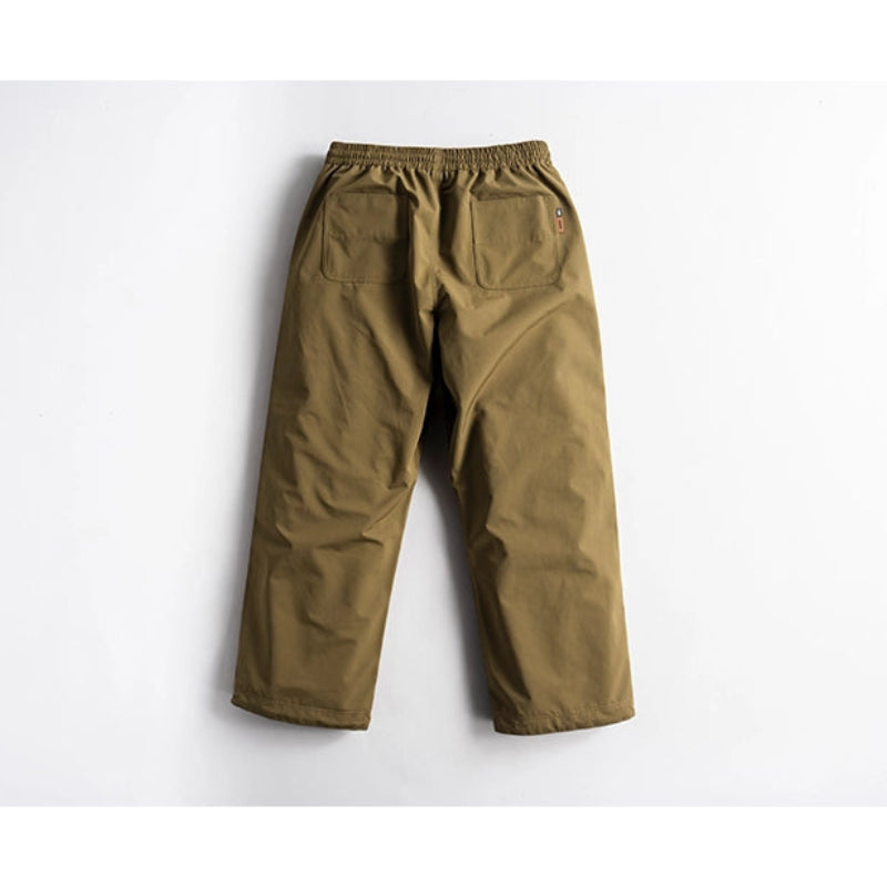 Back view of army green snow pants with elastic waist.