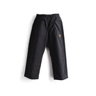 Black wide-leg snow pants with an elastic waistband and a small orange circular logo on the upper left thigh, shown against a plain white background.