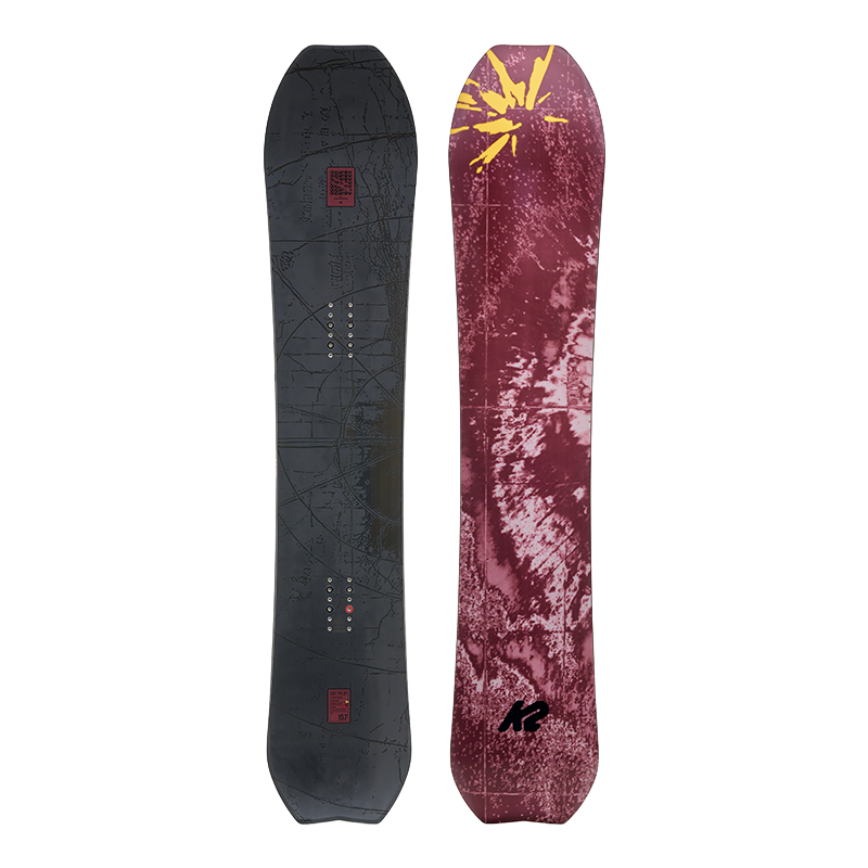 Two snowboard topsheets shown upright against a solid black background, displaying the base and backings. The left board has a dark gray base with subtle white line art and small red accents.