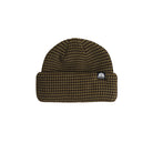 A ribbed knit beanie hat in a dark brown and black micro-check pattern, featuring a small white embroidered logo patch on the front cuff.