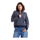 A woman modeling a navy blue and white striped quarter-zip knit sweater with a stand-up collar, paired with blue jeans, against a solid white background.