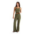A woman modeling a matching ribbed knit two-piece set consisting of a cropped tank top and wide-leg pants in olive green, shown against a plain white background.