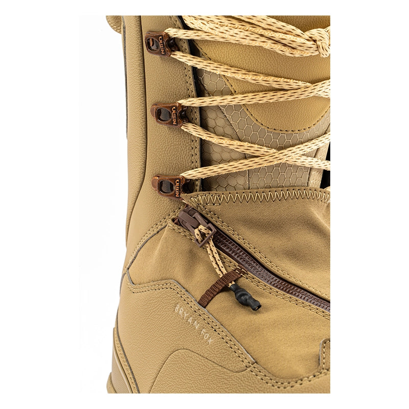 Close-up of a tan waterproof boot with beige laces, brown zipper details, and a small zippered pocket on a white background.