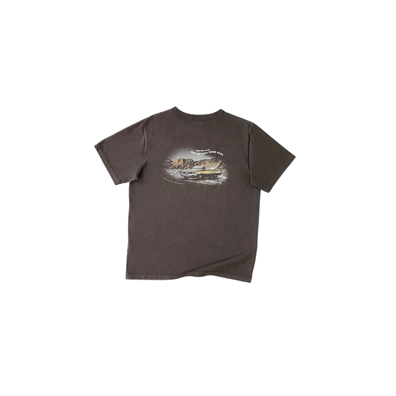 A dark brown short-sleeve t-shirt with a vintage-style scenic graphic print on the chest, displayed flat against a light beige background.