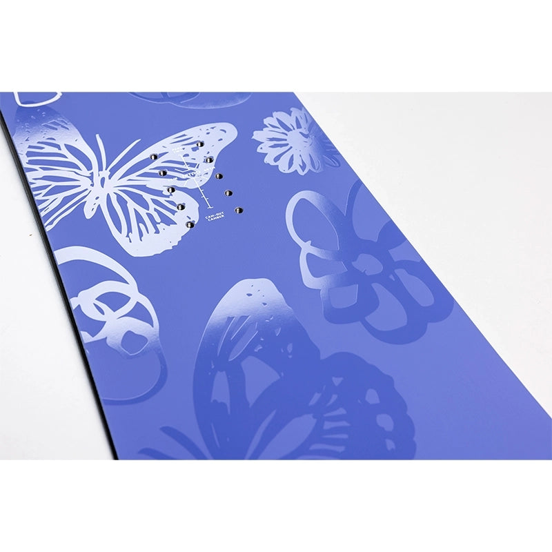 A blue rectangular card or sheet with white butterfly and floral cutout designs, photographed at an angle on a white background.