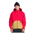 A man wearing a red and tan color-blocked hooded jacket, a black beanie, and dark pants, standing against a solid white background.